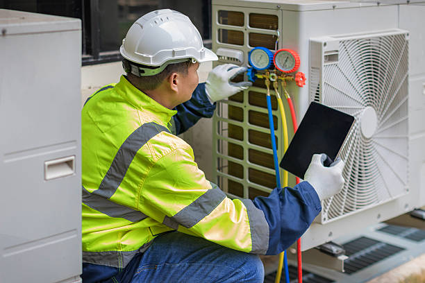 Professional Air Conditioning Repair technician working in Exeter, RI